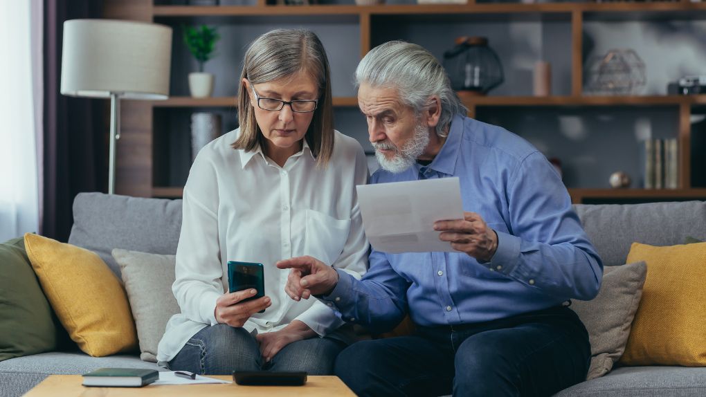 Couple discussing putting their home in a property trust to avoid care home fees