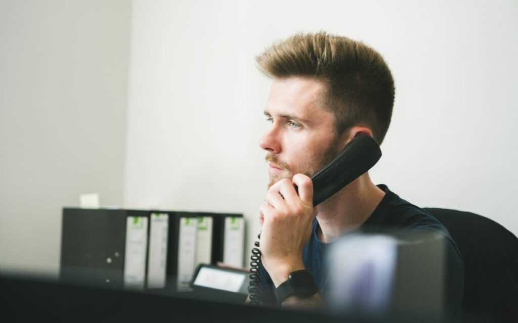 One of Scott Bailey's expert litigators discussing part 36 offers with a client over the phone