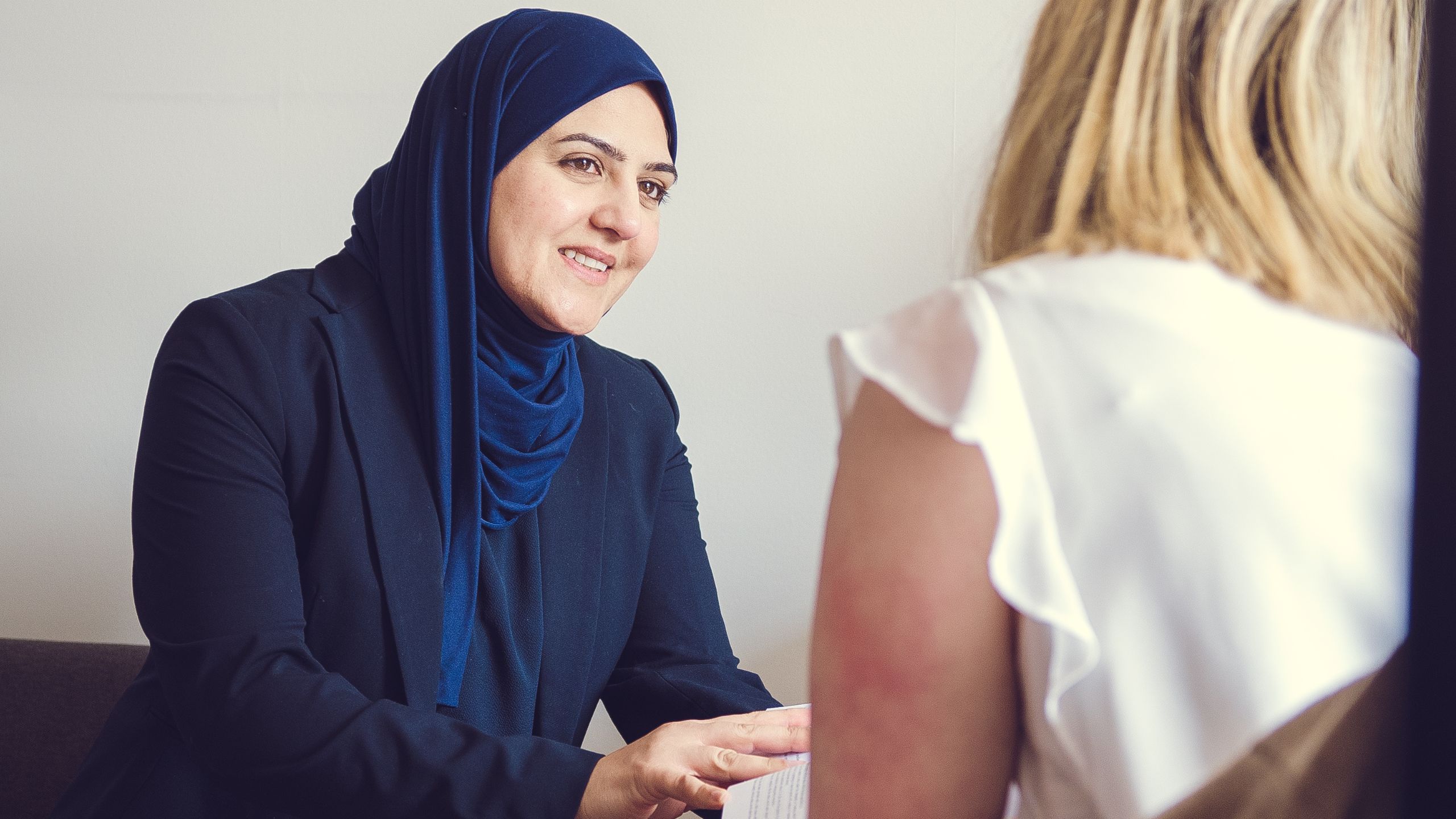 Azmi Quraishe, Litigation and Dispute Resolution Solicitor, in a meeting with a client