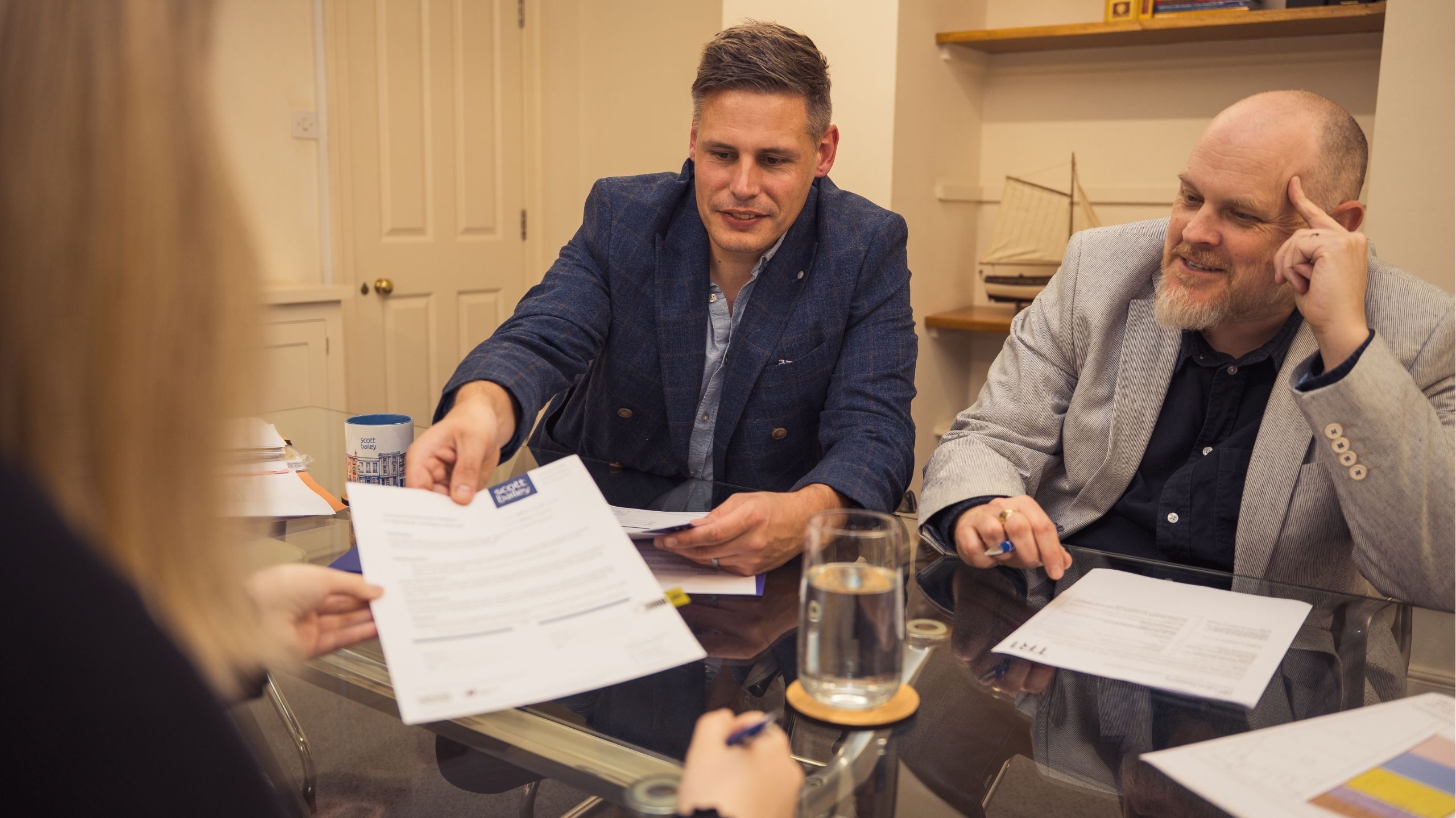 James Burford, Residential Conveyancing Solicitor, and Daniel Ratcliff, Chartered Legal Executive, in a meeting with a client
