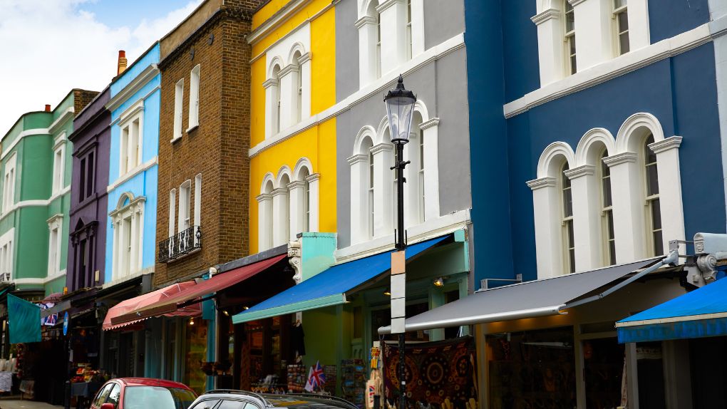 A row of colourful high street shops in England