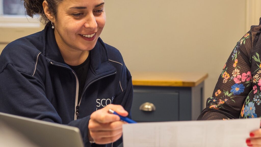 Danielle Harvey, wills, trusts and probate associate solicitor, explaining a legal document to a client